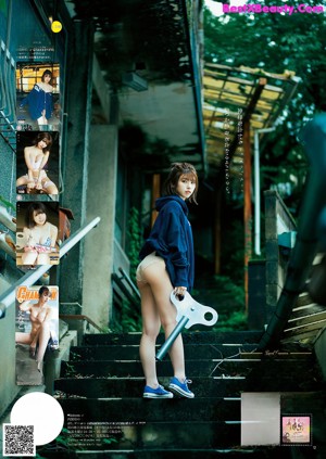 A woman in lingerie sitting on top of a cardboard box.
