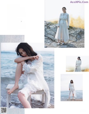 A woman in a white dress standing on a beach.