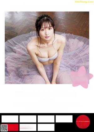 A woman in a white lingerie posing for a picture.